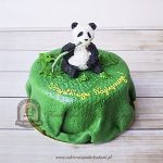 Tort miś panda jedzący pędy bambusa