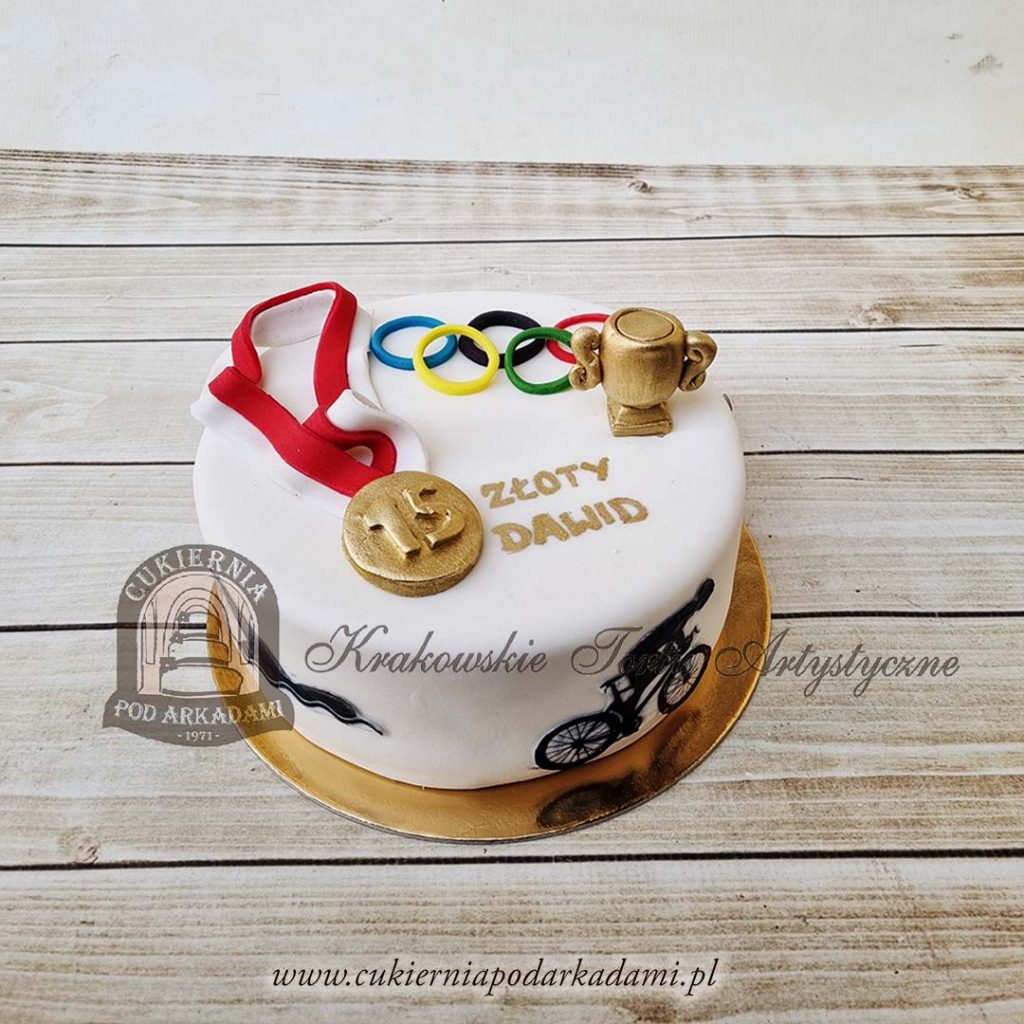 383BA Tort ze złotym medalem olimpijskim i dyscyplinami sportowymi-cukiernia-pod-arkadami